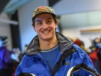 Ethan Seigwart with his 2017 Harbor - Petosky High School Ski Racing Ski Invitations Boys Overall First Place award.