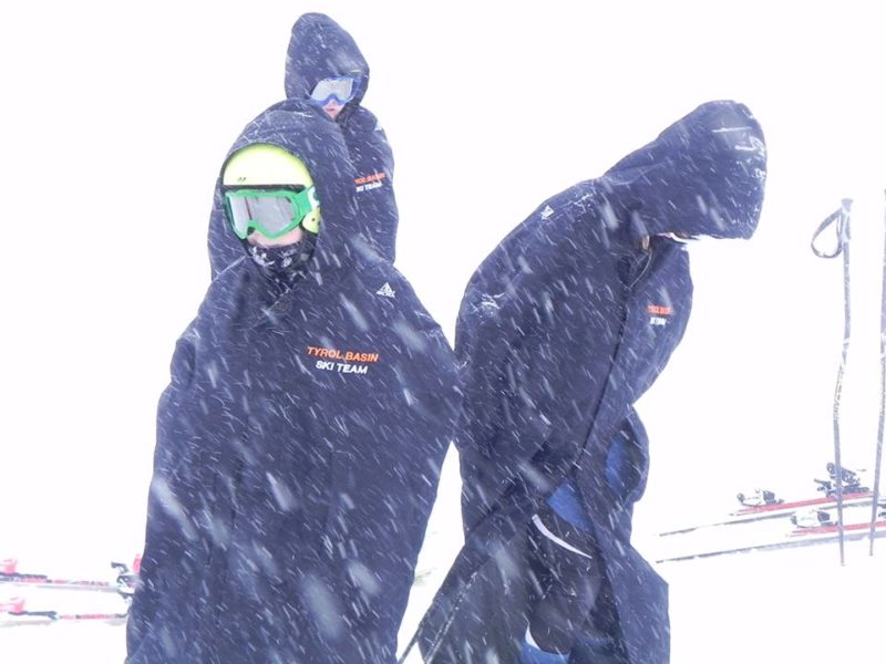Wear an Arctica Race Cape for protection from the elements when ski racing.